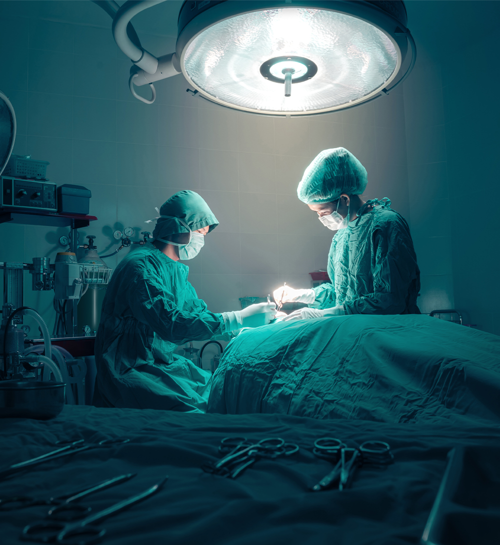 Two doctors perform surgery
