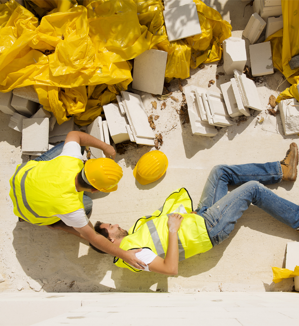Construction worker lays motionless among site debris